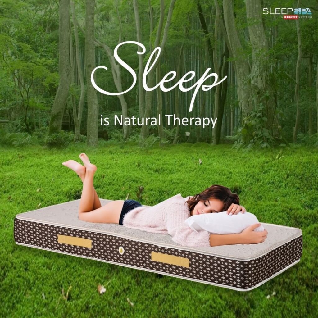 A girl asleep on a mattress